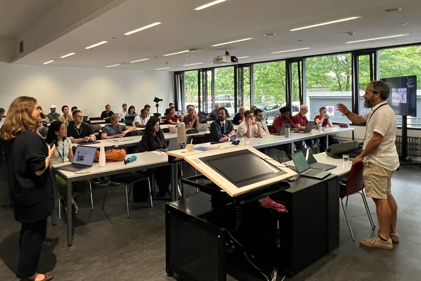 A session in room E040 at DocEng 2026